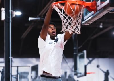 Professional basketball player dunks at the Northway pro-am